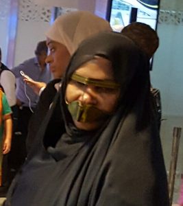 Muzzled woman in Abu Dhabi Photo by Philippe Karsenty